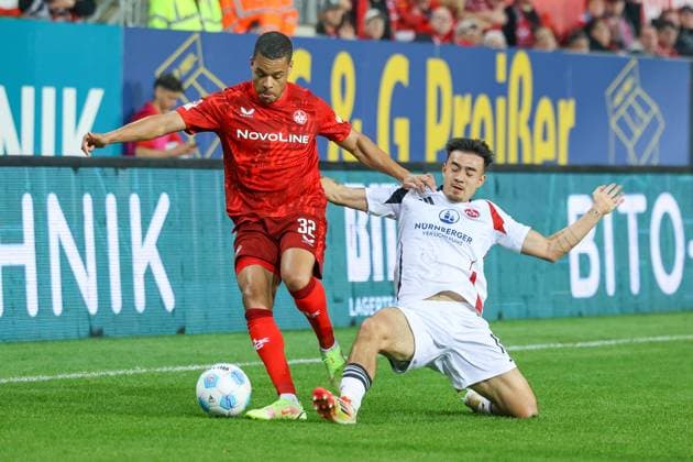 12.04.2025, xmohx, Fussball 2.Bundesliga, 1.FC Kaiserslautern - 1.FC Nürnberg v.l. Jan Gyamerah (1. FC Kaiserslautern) Julian Justvan (1.FC Nuernberg) Zweikampf, Aktion, action, battle for the ball (DFL DFB REGULATIONS PROHIBIT ANY USE OF PHOTOGRAPHS as IMAGE SEQUENCES and or QUASI-VIDEO) Kaiserslautern
