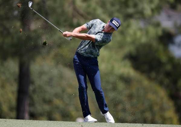 Matt McCarty hits his approach shot to the 1st hole during the third round of the 2025 Masters golf tournament at Augusta National Golf Club in Augusta, Georgia, on Saturday, April 12, 2025.  AUG20250412522 JOHNxANGELILLO