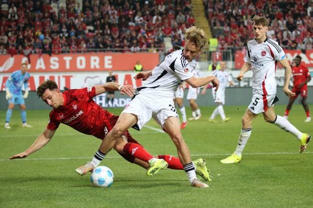 12.04.2025, xmohx, Fussball 2.Bundesliga, 1.FC Kaiserslautern - 1.FC Nürnberg v.l. Tim Drexler (1.FC Nuernberg) Daniel Hanslik (1. FC Kaiserslautern) Zweikampf, Aktion, action, battle for the ball (DFL DFB REGULATIONS PROHIBIT ANY USE OF PHOTOGRAPHS as IMAGE SEQUENCES and or QUASI-VIDEO) Kaiserslautern