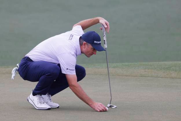 Justin Rose of England prepares to putt on the 2nd hole during the third round of the 2025 Masters golf tournament at Augusta National Golf Club in Augusta, Georgia, on Saturday, April 12, 2025.  AUG20250412540 TANNENxMAURY