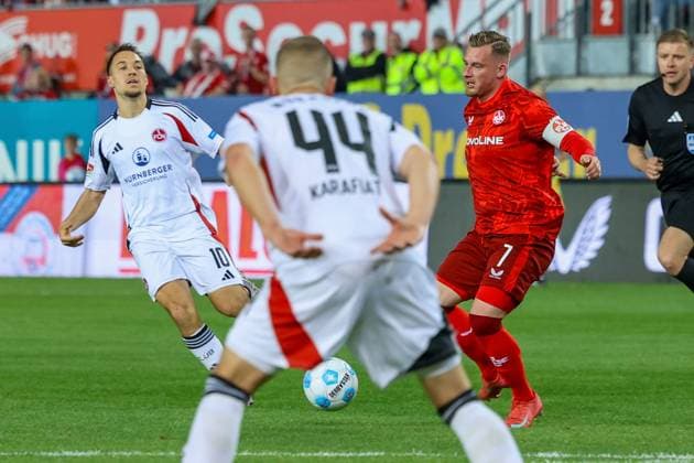 12.04.2025, xmohx, Fussball 2.Bundesliga, 1.FC Kaiserslautern - 1.FC Nürnberg v.l. Julian Justvan (1.FC Nuernberg) Marlon Ritter (1. FC Kaiserslautern) (DFL DFB REGULATIONS PROHIBIT ANY USE OF PHOTOGRAPHS as IMAGE SEQUENCES and or QUASI-VIDEO) Kaiserslautern