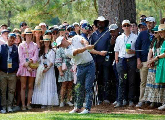 Rory McIlroy of Northern Ireland hits out of the rough on the 7th hole during the third round of the 2025 Masters golf tournament at Augusta National Golf Club in Augusta, Georgia, on Saturday, April 12, 2025.  AUG20250412544 JOHNxANGELILLO