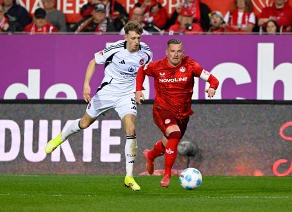 Fussball - 2. Bundesliga - Saison 2024 25 1. FC Kaiserslautern 12.04.2025 Fritz-Walter-Stadion 1. FC Kaiserslautern (fck) - 1. FC Nürnberg (fcn) 1:2 Tim TREXLER(1. FC Nürnberg), li - Marlon RITTER (1. FC Kaiserslautern) 1. FC Kaiserslautern