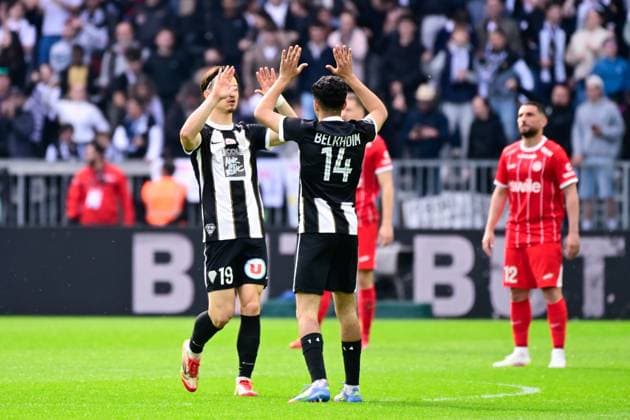 FOOTBALL : Angers vs Montpellier - Ligue 1 - 13 04 2025 Esteban LEPAUL ( 19 - Angers ) celebrates with Yassin Belkhdim ( 14 - Angers ) during the Ligue 1 match between Angers SCO and Montpellier HSC at Stade Raymond Kopa on April 13, 2025 in Angers, France. ( Photo by Dante Badano PsnewZ ) - AngersFrance  Copyright: xDantexBadanox