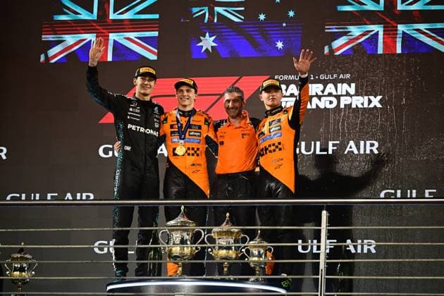 F1 Grand Prix of Bahrain George Russell of Mercedes-AMG Petronas, Oscar Piastri of McLaren F1 Team, team principal Andrea Stella of McLaren F1 Team, and Lando Norris of McLaren F1 Team celebrate on the podium during the race of the Bahrain GP, the 4th round of the Formula 1 World Championship, WM, Weltmeisterschaft at Bahrain International Circuit in Sakhir, Bahrain, on April 13, 2025. Sakhir Bahrain  Copyright: xAndreaxDiodatox originalFilename:diodato-f1bahrai250413_npyTG.jpg