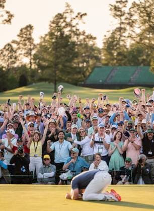250413 Patrons celebrate as Rory McIlroy of Northern Ireland sinks his final putt in the playoff to win the final round of the 2025 Masters Golf Tournament on April 13, 2025 in Augusta. Photo: Petter Arvidson BILDBYRAN kod PA PA1010 bbeng golf masters the masters augusta us masters Copyright: PETTERxARVIDSON BB250413PA157