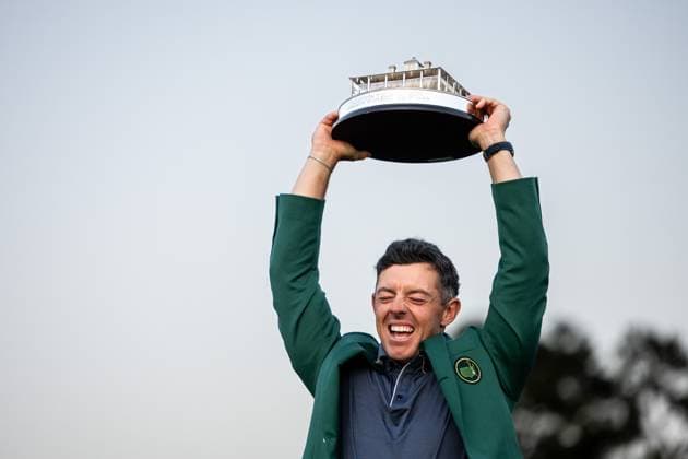 250413 Rory McIlroy of Northern Ireland celebrates with the Masters trophy during the Green Jacket Ceremony after winning the 2025 Masters Golf Tournament on April 13, 2025 in Augusta. Photo: Petter Arvidson BILDBYRAN kod PA PA1010 bbeng golf masters the masters augusta us masters jubel Copyright: PETTERxARVIDSON BB250413PA189