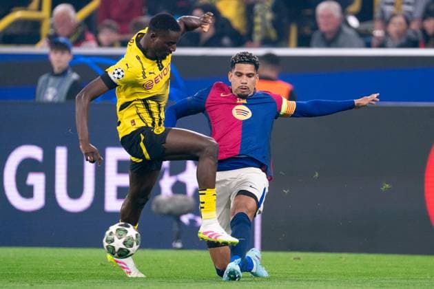 2025-04-15 Borussia Dortmund v FC Barcelona, Barca - UEFA Champions League 2024 25 Quarter Final Second Leg DORTMUND, GERMANY - APRIL 15: Ronald Araujo of FC Barcelona battles for the ball with Serhou Guirassy of Borussia Dortmund during the UEFA Champions League 2024 25 Quarter Final Second Leg match between Borussia Dortmund and FC Barcelona at BVB Stadion Dortmund on April 15, 2025 in Dortmund, Germany. Dortmund BVB Stadion Dortmund Germany Content not available for redistribution in The Netherlands directly or indirectly through any third parties. Copyright: xJorisxVerwijstx