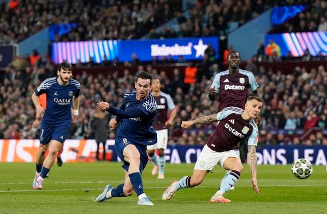 Birmingham, England, 15th April 2025. Fabian Ruiz of Paris St Germain shoots past Aston Villa s Lucas Digne during the Aston Villa vs Paris Saint Germain Quarter Final 2nd Leg UEFA Champions League match at Villa Park, Birmingham. Picture credit should read: Andrew Yates Sportimage EDITORIAL USE ONLY. No use with unauthorised audio, video, data, fixture lists, club league logos or live services. Online in-match use limited to 120 images, no video emulation. No use in betting, games or single club league player publications. SPI_062_AY_Villa_PSG SPI-3842-0062