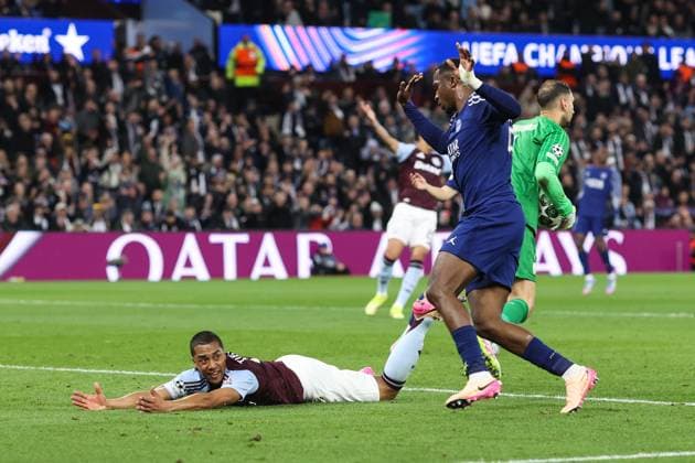 Aston Villa v PSG 15 April 2025, Aston - Champions League Football, Quarter-Final, Second Leg - Aston Villa v Paris Saint-Germain - Willian Pacho of PSG trips Youri Tielemans of Aston Villa - Photo: Charlotte Wilson Offside. Aston UK Copyright: xCharlottexWilsonx xOffsidexOffside