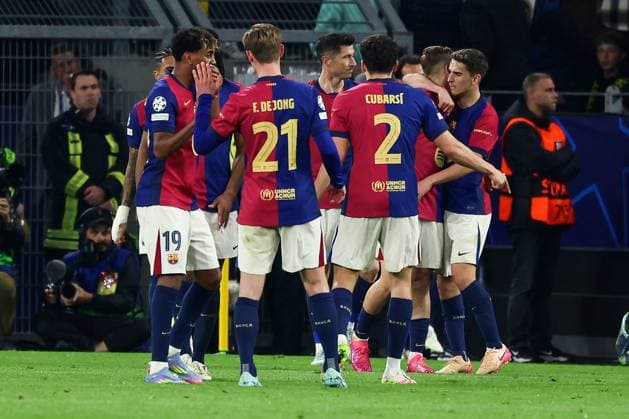 (250416) -- DORTMUND, April 16, 2025 -- Players of FC Barcelona, Barca celebrate after the own goal scored by Ramy Bensebaini of Borussia Dortmund during the UEFA Champions League quarterfinal 2nd leg football match between Borussia Dortmund and FC Barcelona in Dortmund, Germany, April 15, 2025. (Photo by Xinhua) (SP)GERMANY-DORTMUND-FOOTBALL-UEFA CHAMPIONS LEAGUE-DORTMUND VS BARCELONA JoachimxBywaletz 