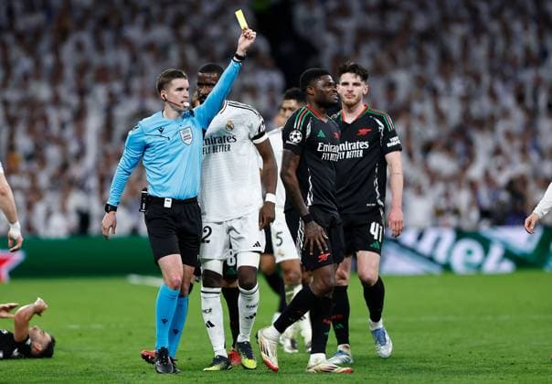 Thomas Partey of Arsenal fouls Dani Ceballos of Real Madrid to earn a yellow card ruling him out of the first leg of a potential semi final vs PSG Real Madrid v Arsenal, UEFA Champions League, Quarter-Finals, 2nd Leg, Football, Santiago Bernabu Stadium, Madrid, Spain - 16 Apr 2025 EDITORIAL USE ONLY No use with unauthorised audio, video, data, fixture lists, club league logos or live services. Online in-match use limited to 120 images, no video emulation. No use in betting, games or single club league player publications.  Copyright: xRubenxAlbarran Shutterstockx 15253938cx