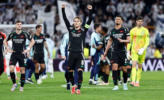 Martin Odegaard of Arsenal celebrates at full time Real Madrid v Arsenal, UEFA Champions League, Quarter-Finals, 2nd Leg, Football, Santiago Bernabu Stadium, Madrid, Spain - 16 Apr 2025 EDITORIAL USE ONLY No use with unauthorised audio, video, data, fixture lists, club league logos or live services. Online in-match use limited to 120 images, no video emulation. No use in betting, games or single club league player publications.  Copyright: xRubenxAlbarran Shutterstockx 15253938ds