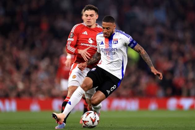 Manchester United, ManU v Olympique Lyonnais 17th April 2025 - UEFA Europa League - Quarter Final (2nd Leg) - Manchester United v Olympique Lyonnais - Corentin Tolisso of Olympique Lyonnais is challenged by Manuel Ugarte of Manchester United - Photo: Simon Stacpoole Offside. Manchester UK Copyright: xSimonxStacpoolexOffside