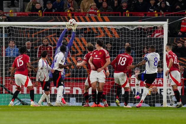 Manchester, England, 17th April 2025. Andrà Onana of Manchester United, ManU makes a save from Paul Akouokou of Lyon during the Manchester United vs Olympique Lyonnais Quarter Final 2nd Leg UEFA Europa League match at Old Trafford, Manchester. Picture credit should read: Andrew Yates Sportimage EDITORIAL USE ONLY. No use with unauthorised audio, video, data, fixture lists, club league logos or live services. Online in-match use limited to 120 images, no video emulation. No use in betting, games or single club league player publications. SPI_065_AY_MANCHESTER_UNITED_V_OLYMPIQUE_LYONNAIS SPI-3844-0045