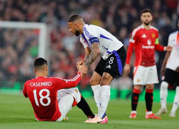 17th April 2025; Old Trafford, Manchester, England; Europa League Quarter Final Second Leg Football, Manchester United, ManU versus Lyon; Casemiro of Manchester United is fouled by Corentin Tolisso (c) of Lyon  ActionPlus12775500 RogerxEvans