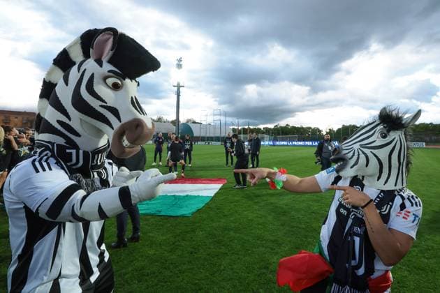 Biella, Italy, 18th April 2025. Lisa Boattin of Juventus wearing a zebra mask celebrates the club™s 6th league title with club masscot Jay the zebra following the Juventus Women vs AC Milan Women Serie A Femminile match at Stadio Vittorio Pozzo, Biella. Picture credit should read: Jonathan Moscrop Sportimage EDITORIAL USE ONLY. No use with unauthorised audio, video, data, fixture lists, club league logos or live services. Online in-match use limited to 120 images, no video emulation. No use in betting, games or single club league player publications. SPI_029_JM_JUVE_MILAN_FEMM_ SPI-3835-0029