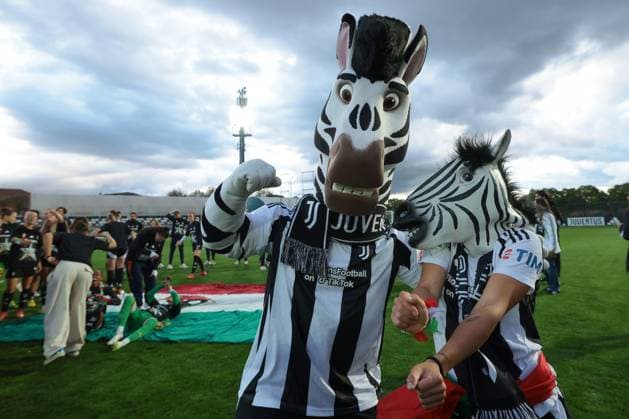 Biella, Italy, 18th April 2025. Lisa Boattin of Juventus wearing a zebra mask celebrates the club™s 6th league title with club masscot Jay the zebra following the Juventus Women vs AC Milan Women Serie A Femminile match at Stadio Vittorio Pozzo, Biella. Picture credit should read: Jonathan Moscrop Sportimage EDITORIAL USE ONLY. No use with unauthorised audio, video, data, fixture lists, club league logos or live services. Online in-match use limited to 120 images, no video emulation. No use in betting, games or single club league player publications. SPI_031_JM_JUVE_MILAN_FEMM_ SPI-3835-0031