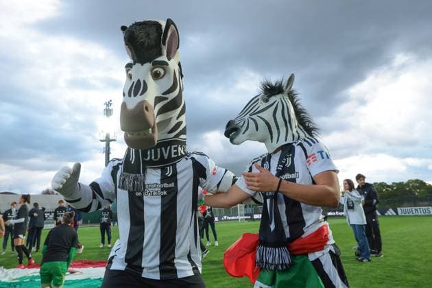 Biella, Italy, 18th April 2025. Lisa Boattin of Juventus wearing a zebra mask celebrates the club™s 6th league title with club masscot Jay the zebra following the Juventus Women vs AC Milan Women Serie A Femminile match at Stadio Vittorio Pozzo, Biella. Picture credit should read: Jonathan Moscrop Sportimage EDITORIAL USE ONLY. No use with unauthorised audio, video, data, fixture lists, club league logos or live services. Online in-match use limited to 120 images, no video emulation. No use in betting, games or single club league player publications. SPI_032_JM_JUVE_MILAN_FEMM_ SPI-3835-0032