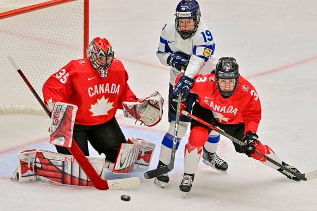 (L-R) Goalkeeper Ann-Renee Desbiens of Canada, Ida Kuoppala of Finland and Jocelyne Larocque of Canada in action during the Ice hockey, Eishockey IIHF WomenÂ s World Championship, WM, Weltmeisterschaft semifinal match Canada vs Finland, Ceske Budejovice, Czech Republic, April 19, 2025. (CTKxPhoto VaclavxPancer) CTKPhotoP2025041905270  CTKPhotoP2025041905270