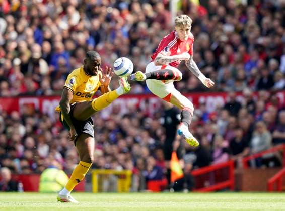 Sport Themen der Woche KW16 Manchester, England, 20th April 2025. Alejandro Garnacho of Manchester United, ManU (R) challenges Toti Gomes of Wolverhampton Wanderers during the Manchester United vs Wolverhampton Wanderers Premier League match at Old Trafford, Manchester. Picture credit should read: Andrew Yates Sportimage EDITORIAL USE ONLY. No use with unauthorised audio, video, data, fixture lists, club league logos or live services. Online in-match use limited to 120 images, no video emulation. No use in betting, games or single club league player publications. SPI_004_AY_MAN_UTD_WOLVES SPI-3852-0004