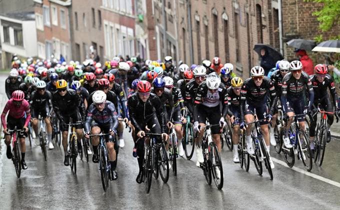 The pack of riders and Belgian Remco Evenepoel of Soudal Quick-Step (R) pictured in action in the climb Cote de Cherave during the men s race of the La Fleche Wallonne , one day cycling race (Waalse Pijl - Walloon Arrow), 205,2 km from Ciney to Huy, Wednesday 23 April 2025. DIRKxWAEM  x121638840x