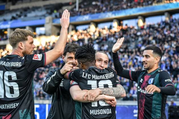 Fussball 2.Bundesliga, Hertha BSC Berlin - 1.FC Magdeburg 25.04.2025, xdanx, Fussball 2.Bundesliga, Hertha BSC Berlin - 1.FC Magdeburg v.l. Marcus Mathisen (1.FC Magdeburg),Lubambo Musonda (1.FC Magdeburg),BarÄ±Åü Atik (1.FC Magdeburg), Livan Burcu (1.FC Magdeburg) Jubel nach dem 0:1 (DFL DFB REGULATIONS PROHIBIT ANY USE OF PHOTOGRAPHS as IMAGE SEQUENCES and or QUASI-VIDEO) Daniel Lakomski Mix1Press Berlin Olympiastadion Berlin Deutschland (DEU)