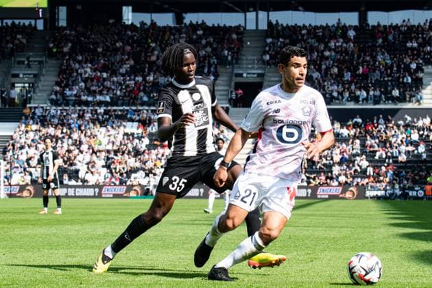 FOOTBALL : SCO Angers vs Lille OSC - Ligue 1 - JournÃ e 31 - 27 04 2025 Benjamin AndrÃ (Lille OSC) Prosper Peter (ANGERS SCO) AngersFrance  Copyright: xBaptistexAutissierx