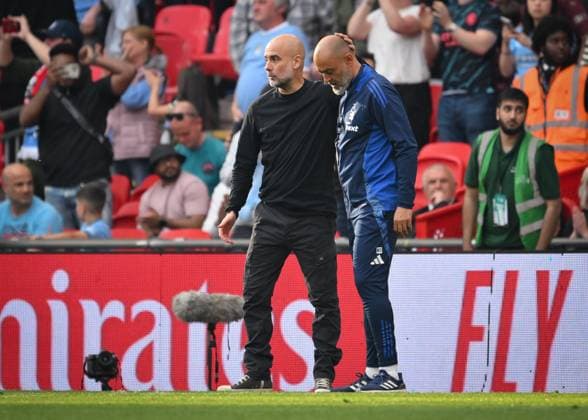 Football - 2024 2025 Emirates FA Cup - Semi-Final - Nottingham Forest vs Manchester City - Wembley Stadium - Sunday 28th April 2025. Manchester City manager Pep Guardiola with Nottingham Forest Manager Nuno Espirito Santo at the final whistle. COLORSPORT Ashley Western 