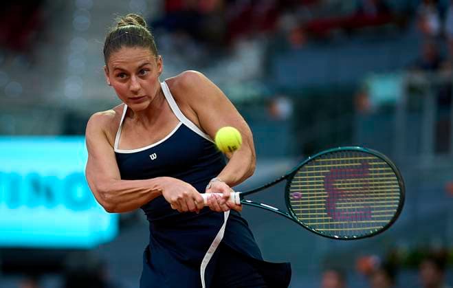 (250501) -- MADRID, May 1, 2025 -- Marta Kostyuk competes during the women s singles quarterfinal between Aryna Sabalenka of Belarus and Marta Kostyuk of Ukraine at the Madrid Open tennis tournament, in Madrid, Spain, April 30, 2025. (Photo by Xinhua) (SP)SPAIN-MADRID-TENNIS-MADRID OPEN-WOMEN S SINGLES PabloxMorano 