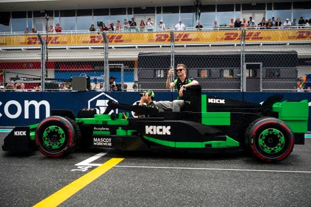 Brazilian Formula One driver Gabriel Bortoleto and German Formula One driver Nico Hulkenberg of Stake F1 Team are seen in a Lego car during the drivers parade at Formula One Miami Grand Prix at the Miami International Autodrome in Miami Gardens, Florida on Sunday, May 4, 2025.  MIA2025050438 GREGxNASH