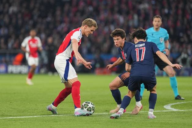 Martin Odegaard of Arsenal takes on Joao Neves of PSG and Vitinha of PSG Paris Saint-Germain v Arsenal, UEFA Champions League, Semi Final, Second Leg, Football, Parc des Princes, Paris, France - 07 May 2025 EDITORIAL USE ONLY No use with unauthorised audio, video, data, fixture lists, club league logos or live services. Online in-match use limited to 120 images, no video emulation. No use in betting, games or single club league player publications. Copyright: xDavexWinter Shutterstockx 15288067ag