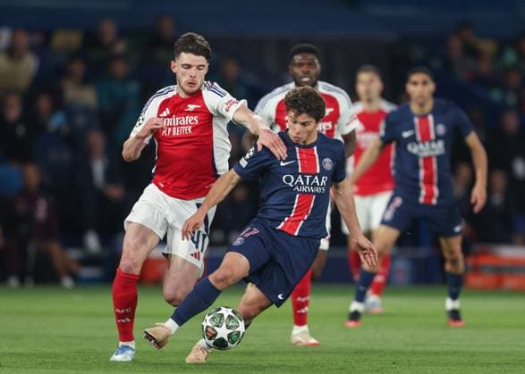 Paris, France, 7th May 2025. Joao Neves of Paris Saint-Germain and Declan Rice of Arsenal battle for the ball during the Paris Saint Germain vs Arsenal UEFA Champions League match at Le Parc des Princes, Paris. Picture credit should read: David Klein Sportimage EDITORIAL USE ONLY. No use with unauthorised audio, video, data, fixture lists, club league logos or live services. Online in-match use limited to 120 images, no video emulation. No use in betting, games or single club league player publications. SPI_037_DK_PARIS_ST_GERMAIN_V_ARSENAL SPI-3913-0036