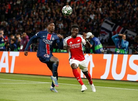Nuno Mendes of PSG and Bukayo Saka of Arsenal comepet for the ball Paris Saint-Germain v Arsenal, Football, UEFA Champions League, Semi-Final 2nd Leg, Parc des Princes, Paris, France - 07 05 2025 Editorial use only  Copyright: xMattxImpey Shutterstockx 15289021i