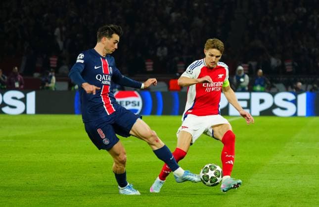 Fabian Ruiz of PSG battles with Martin Odegaard of Arsenal Paris Saint-Germain v Arsenal, UEFA Champions League, Semi Final, Second Leg, Football, Parc des Princes, Paris, France - 07 May 2025 EDITORIAL USE ONLY No use with unauthorised audio, video, data, fixture lists, club league logos or live services. Online in-match use limited to 120 images, no video emulation. No use in betting, games or single club league player publications.  Copyright: xJavierxGarcia Shutterstockx 15288068gb