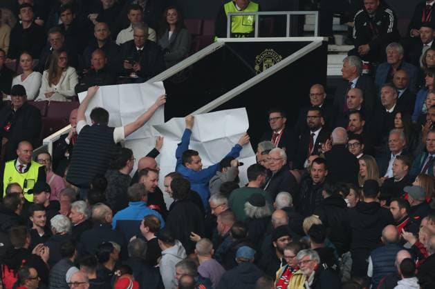 Football - 2024 2025 UEFA Europa League - Semi-Finals - Second Leg - Manchester United, ManU vs Athletic Club, Bilbao - Old Trafford - Thursday 8th May 2025 Protesters unfurl a banner towards Jason Wilcox, Omar Berrada and Sir David Brailsford 