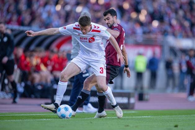 09.05.2025, Fussball, 2. Bundesliga, 33. Spieltag Saison 2024 2025, 1.FC Nürnberg - 1.FC Köln, Dominique Heintz (1. FC Köln), Mahir Emreli (1. FC Nürnberg) xRHR-FOTO TKx
