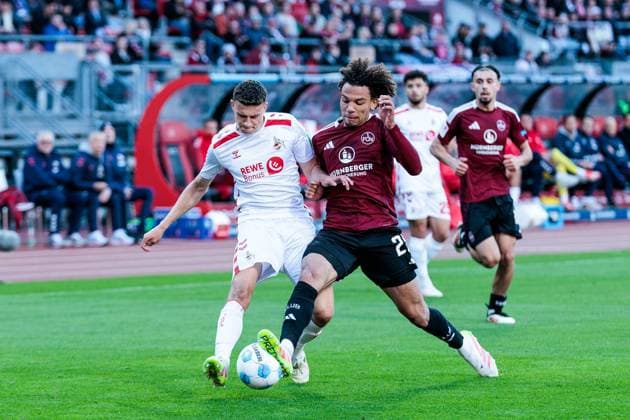 2. Fußball Bundesliga: 1. FC Nürnberg - 1. FC Köln; 09.05.2025 Zweikampf Eric Martel (1. FC Köln, 6), Janis Antiste (1. FC Nürnberg, 28) 2. Fußball Bundesliga, 1. FC Nürnberg - 1. FC Köln, Nürnberg, Max-Morlock-Stadion am 09.05.2025 DFL REGULATIONS PROHIBIT ANY USE OF PHOTOGRAPHS AS IMAGE SEQUENCES AND OR QUASI-VIDEO.