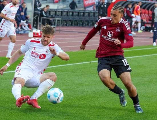 Jan Thielmann 29 (1. FC Koeln) und Rafael Lubach 18 (1FC Nuernberg) im Zweikampf, 1.FC Nuernberg vs. 1.FC Koeln Fussball, 2. Bundesliga, DFL, Saison 2024 2025, Rueckrunde, 33. Spieltag, 09.05.2025 DFB regulations prohibit any use of photographs as image sequences and or quasi-video