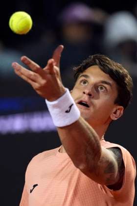 Camilo Ugo Carabelli of Argentina serves during the match against Alexander Zverev of Germany at the Internazionali BNL d Italia 2025 tennis tournament at Foro Italico in Rome, Italy on May 9, 2025. Alexander Zverev won 6-2, 6-1. AntoniettaxBaldassarre
