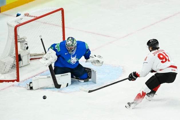 STOCKHOLM, SVERIGE 20250510 Slovenia s goalkeeper Lukas Horak and Canada s Kent Johnson in action during the IIHF Ice hockey, Eishockey World Championship, WM, Weltmeisterschaft group A match between Slovenia and Canada at Avicii Arena in Stockholm, Sweden, on May 10, 2025. STOCKHOLM SVERIGE x10080x