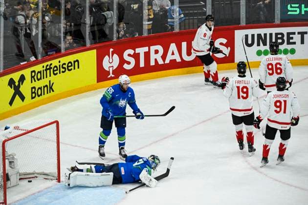 STOCKHOLM, SVERIGE 20250510 Canada s Noah Dobson ( 8, top) celebrates after scoring at Slovenia s goalkeeper Lukas Horak (left) as Slovenia s Robert Sabolic ( 55) looks on during the IIHF Ice hockey, Eishockey World Championship, WM, Weltmeisterschaft group A match between Slovenia and Canada at Avicii Arena in Stockholm, Sweden, on May 10, 2025. STOCKHOLM SWEDEN x10080x