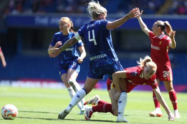 Ceri Holland of Liverpool is brought down to the ground by Millie Bright of Chelsea Chelsea v Liverpool, Football, Barclays Women s Super League, Stamford Bridge, London, UK - 10 05 25 EDITORIAL USE ONLY No use with unauthorised audio, video, data, fixture lists (outside the EU), club league logos or live services. Online in-match use limited to 45 images (+15 in extra time). No use to emulate moving images. No use in betting, games or Copyright: xAnthonyxHanc Shutterstockx 15292910j