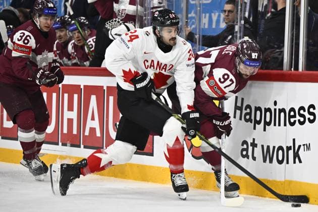 STOCKHOLM, SVERIGE 20250511 Canada s Phillip Danault and Latvia s Haralds Egle during the IIHF Ice hockey, Eishockey World Championship, WM, Weltmeisterschaft group A match between Latvia and Canada at Avicii Arena in Stockholm, Sweden, on May 11, 2025. STOCKHOLM SVERIGE x10430x