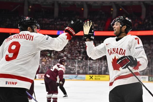 STOCKHOLM, SWEDEN 20250511 Canada s Mike Matheson and Nate MacKinnon celebrating 2-1 during the IIHF Ice hockey, Eishockey World Championship, WM, Weltmeisterschaft group A match between Latvia and Canada at Avicii Arena in Stockholm, Sweden, on May 11, 2025. STOCKHOLM SWEDEN x10430x