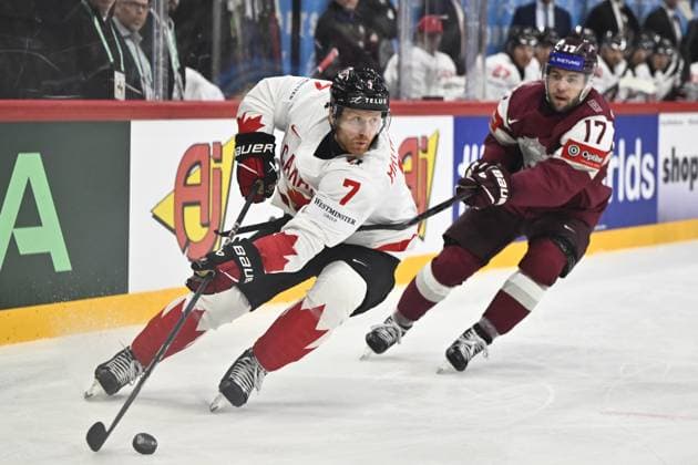 STOCKHOLM, SWEDEN 20250511 Canada s Mike Matheson and Latvia s Martins Dzierkals during the IIHF Ice hockey, Eishockey World Championship, WM, Weltmeisterschaft group A match between Latvia and Canada at Avicii Arena in Stockholm, Sweden, on May 11, 2025. STOCKHOLM SWEDEN x10430x
