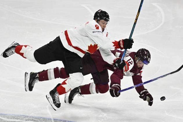 STOCKHOLM, SVERIGE 20250511 Canada s Nate MacKinnon and Latvia s Glebs Prohorenkovs during the IIHF Ice hockey, Eishockey World Championship, WM, Weltmeisterschaft group A match between Latvia and Canada at Avicii Arena in Stockholm, Sweden, on May 11, 2025. STOCKHOLM SVERIGE x10430x