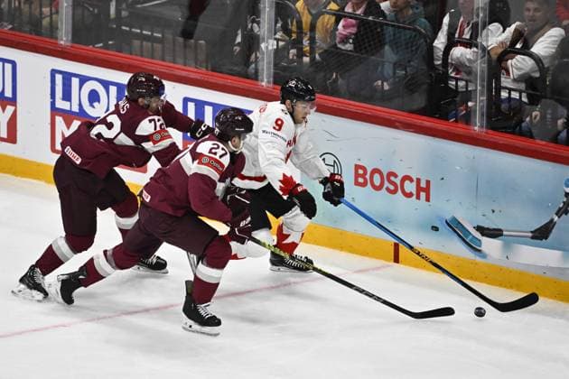 STOCKHOLM, SWEDEN 20250511 Canada s Nate MacKinnon and Latvia s Glebs Prohorenkovs during the IIHF Ice hockey, Eishockey World Championship, WM, Weltmeisterschaft group A match between Latvia and Canada at Avicii Arena in Stockholm, Sweden, on May 11, 2025. STOCKHOLM SWEDEN x10430x