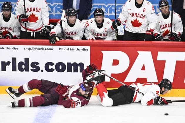 STOCKHOLM, SVERIGE 20250511 Latvia s Kaspars Daugavins and Canada s Ryker Evans during the IIHF Ice hockey, Eishockey World Championship, WM, Weltmeisterschaft group A match between Latvia and Canada at Avicii Arena in Stockholm, Sweden, on May 11, 2025. STOCKHOLM SVERIGE x10430x