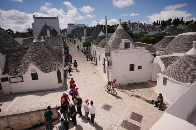 Riders trought trulli before the start during the stage 4 of the Giro d™Italia from Alberobello (Pietramadre) to Lecce, Italy - Tuesday, May 13, 2025. - cycling.  Copyright: xMarcoxAlpozzi LaPressex